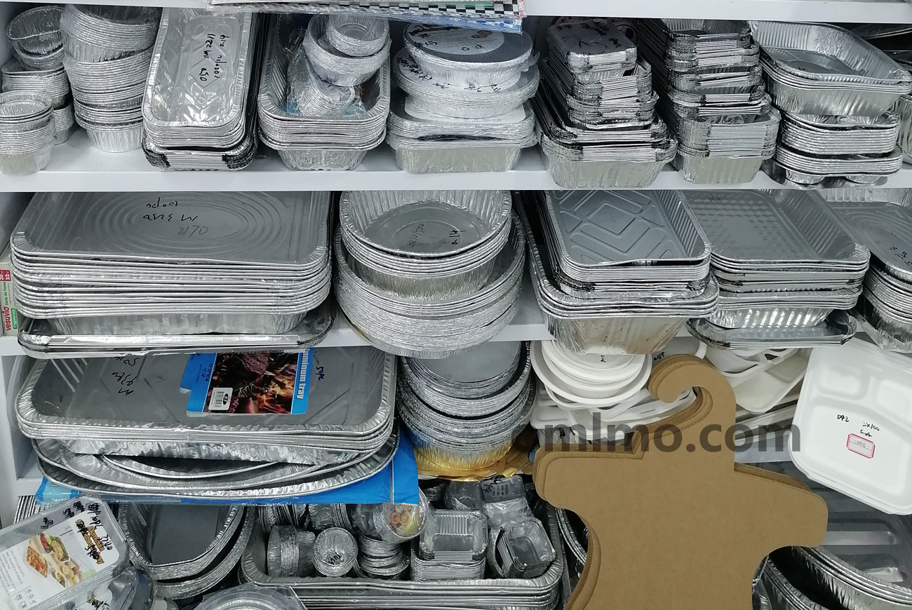 White metal shelving unit displaying rectangular aluminum foil roasting pans and lidded containers in multiple sizes
