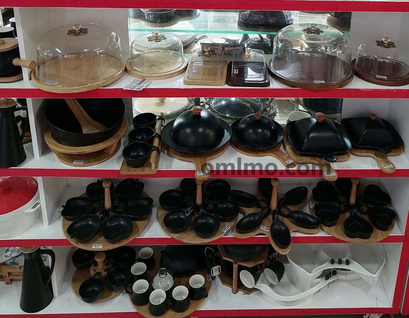 Black and white ceramic tea coffee sets and mug tree displays on bamboo rotating stands, showing teapot sets, cup sets, and mug trees on bottom shelf