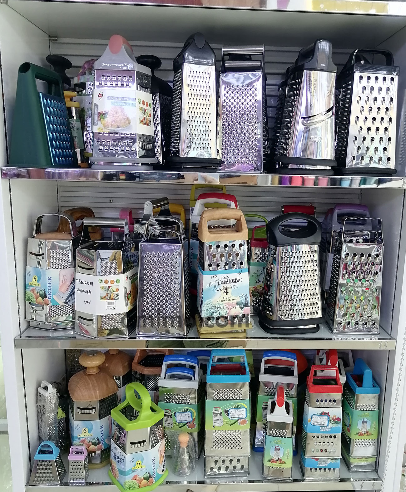BA-216 Stainless steel 6-in-1 multi-function grater with transparent storage container on retail shelf